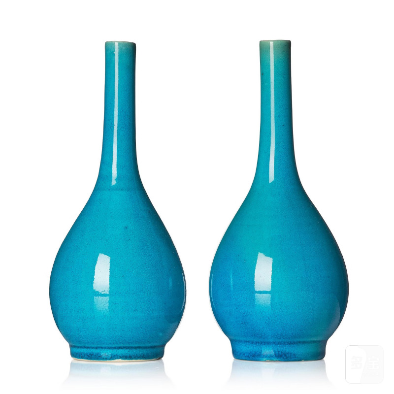 A pair of turquoise glazed vases,